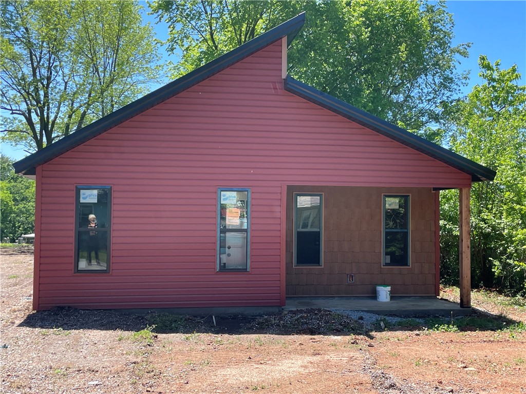 New construction home perfect for you. Granite counters with soft close cabinets. The Ribbon driveway will add to the home's charm and the yard will be seeded for grass. Bedrooms will fit a king-size bed. Large yard that can be fenced. The road behind the home is public and a gate could be put there to use as an entry to the home. 26 minutes to Walmart Home office