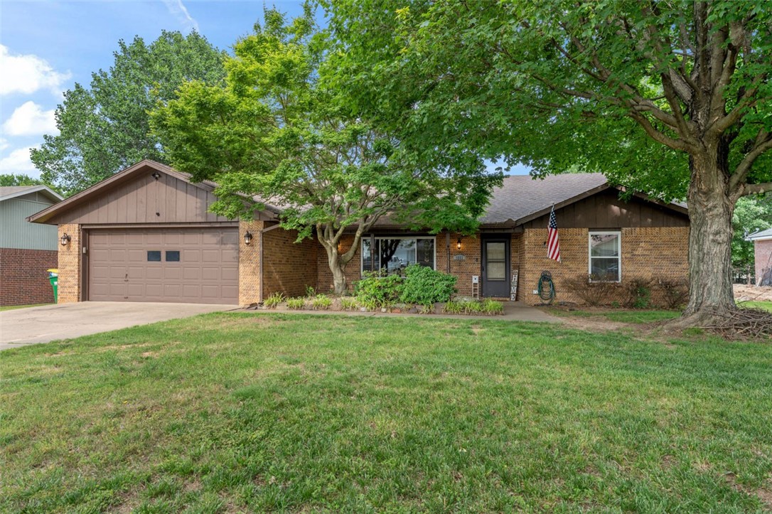 You do not want to miss this 3 bed/2 bath home on over 1/2 acre lot! Has split floor plan and large kitchen with tons of cabinet space and storage. Family room has oversize window and a cozy fireplace and is perfect for gathering to watch a movie or just hang out. Lot is 0.56 acres and provides both mature trees in the front and plenty of space to run and play or build your private oasis in the back. Covered deck provides shade when you want it and your friends and family will love jumping in the Burton above-ground pool. New pool pump was purchased and installed 5/23. 2 storage sheds in back convey and will hold all your garage overflow and yard equipment. Centrally located just minutes from JB Hunt and Tyson Foods headquarters, a few minutes from I-49 and only 2 minutes from the Razorback Greenway. Walden Street is not a cookie-cutter street with and does not go all the way through. You will love the small-town feel of great neighbors and tree-lined streets but enjoy the amenities of our amazing Metro area!