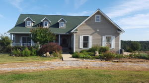 Custom built 3 bedroom 3 bath home on 56 acres in a tranquil country setting. Cathedral ceilings/ 9' thru-out, open floor plan, wood floors, large master/guest suites, large sunroom with wall to wall windows, full walk-out basement, large barn with wood working area, and a view to ''Die For''. If you are looking for a home to enjoy wildlife, peace & quiet & not remote then this is your home!