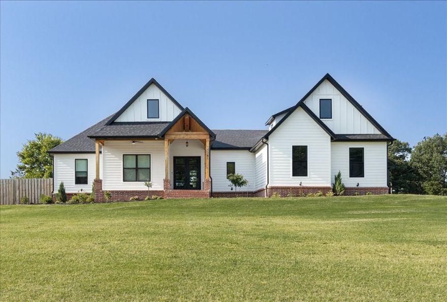 Welcome to your little slice of paradise nestled in the Bentonville School District. This exquisite 4-bedroom, 3.5 bathroom home sits on 1.5 acres and boasts a wealth of amenities that cater to comfort, style, and functionality. 
Step inside to discover beautiful interiors featuring quartz countertops and hard wood floors throughout. Enjoy double ovens, gas range, and oversized fridge in the kitchen. The open concept living area includes a home speaker system, perfect for entertaining and relaxing at home. Additional features include a full master suite with tiled shower and soaker tub, large closet connected to the laundry, 5G internet, programmable thermostat, and heat recirculation pump for efficiency and comfort. 
Outside is a covered patio and large open air brick patio w/ fully fenced yard, Bermuda sod, and landscape irrigation. Enjoy over 200 square feet of raised garden beds and the chicken coop. Bring your toys to store in the 46x50 shop with a 14 foot clearance! 
Modern amenities meets farmhouse style.