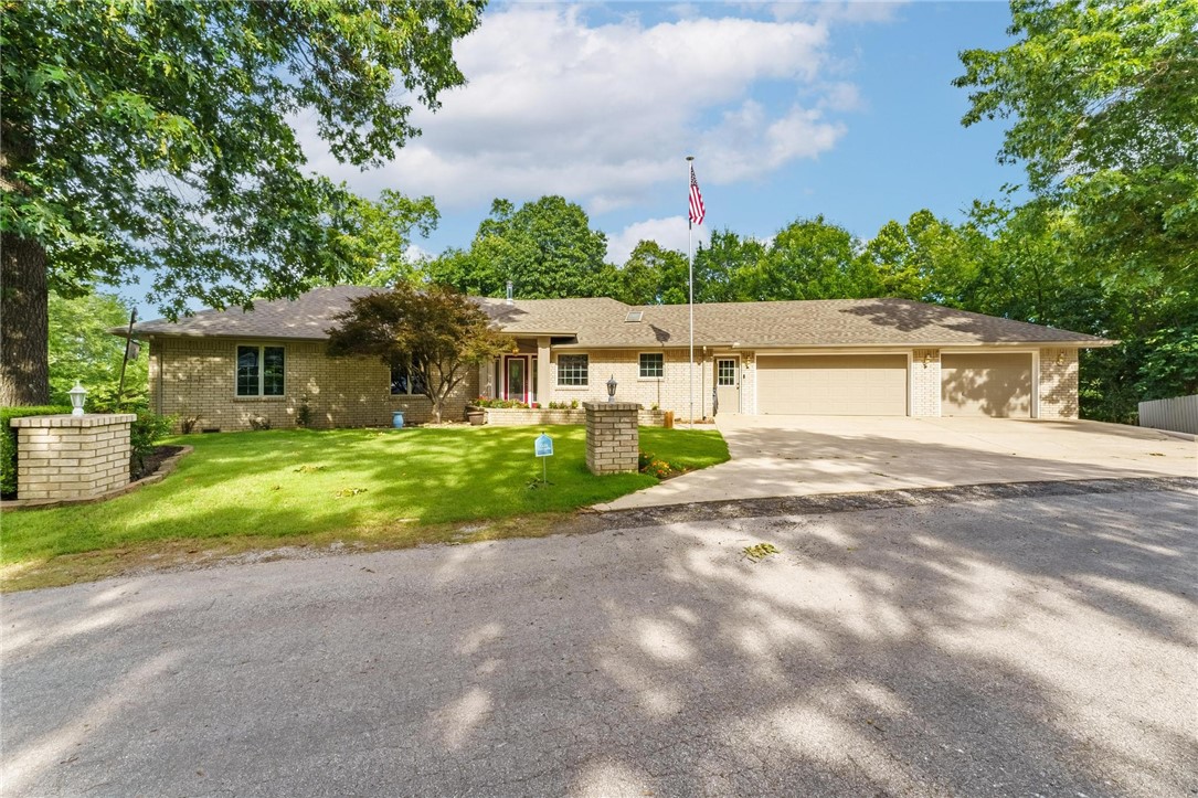 This 3-bedroom, 2.5-bathroom home offers comfort and space close to Lake Windsor, Tanyard Creek, and Bella Vista Country Club. Peace of mind with a new roof, water heater, and HVAC system all installed in 2022, plus a brand-new deck completed in 2025 as well as septic pumped and inspected. The attic fan in the garage helps keep both the home and garage cool while reducing utility costs. Inside, youāll love the elevated sunroom that opens to the main living areaāyour future favorite spot with views of your private, landscaped, partially fenced backyard and seasonal glimpses of Lake Windsor. The large dining room off the kitchen is great for entertaining, and the spacious utility room offers an abundance of storage. Car enthusiasts, hobbyists, or RV and boat owners will appreciate the rare 4-car garage setup: three bays at street level and a fourth accessible via a side drive, where thereās also extra space to park an RV or boat. Third bay set up as a workshop and would need work to park a car. 2 bedroom septic.