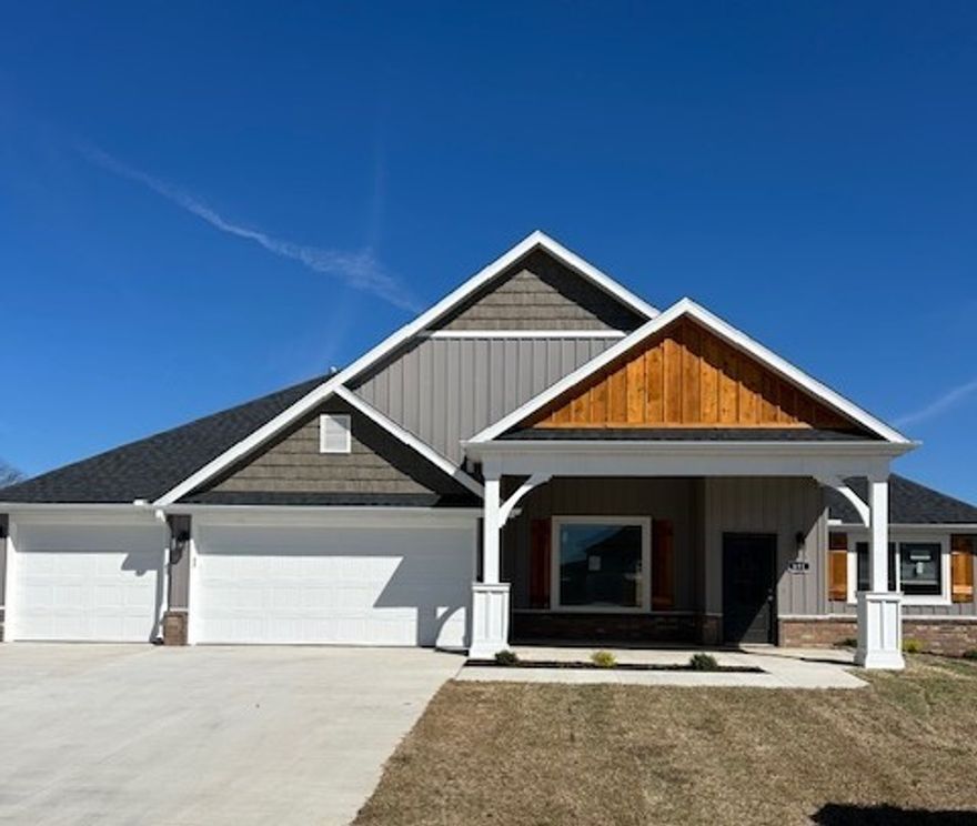 Remarkable new construction 3 bedroom, 2 bathroom single story with 3 car garage home now available. Kitchen is complete w Stainless Steel appliances, gas cooktop, pantry, and granite countertops. Large Fireplace in the living room is the perfect focal point. Details throughout include wood cased windows complete with 2 in blinds. Large front porch, fully sodded oversized yard, landscaping and privacy fence add tremendous curb appeal. The back porch is covered & home has fully installed gutters. Keyless pad on garage door for ease of access. Master bedroom has an oversized tile shower. The Master bedroom and closet conveniently wraps around into the laundry room located close to the garage for ease of access.