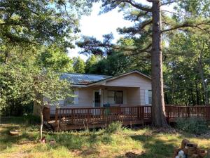 Centrally located 1 bedroom (could be 2) 1 bath fixer upper home, with an expansive deck, on 15 m/l wooded usable acres. Rural water, well, metal roof, less than 30 minutes from Springdale and 20 minutes to Huntsville. Quick commute to work, while still maintaining a quiet country feel.