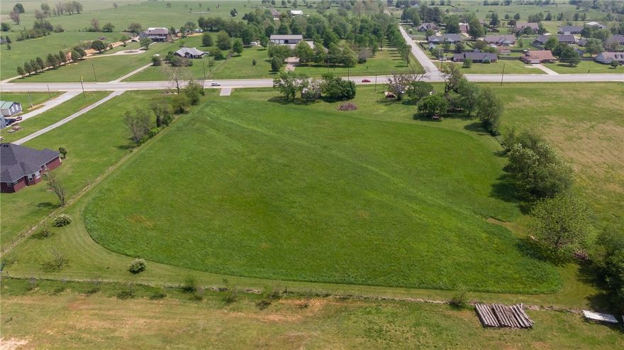 Opportunity to purchase +/- 4.7 acres zoned C-2 Thoroughfare with +/- 407' of Old Wire Road/Highway 265 frontage. West side of property is adjacent to Ward Nail Park; South side of this property is scheduled to have the Monroe Avenue extension, thereby connecting Monroe to Highway 265 at Nail Avenue, and Highway 265 to Monroe which routes all the way west to I49. Also, likely the first Lowell stoplight location on 265. Existing barn and concrete pads on site. Please see interactive map link and listings attachments for further details on zoning and the Monroe Avenue extension plans.