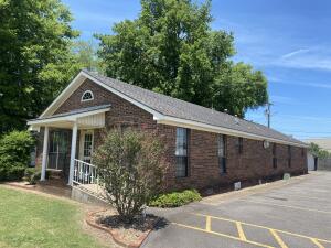 PRIME BUSINESS LOCATION!! This professional building is conveniently located near downtown with great road frontage on Hwy 64/ Main St. This building features a large reception area, receptionist area, 4 restrooms, 4 exam rooms, large office with private bathroom, large kitchen area, loads of cabinets, closets for storage, private rear entrance, handicap accessible front entrance, paved parking area with 15-17 parking spaces and so much more! Call today to schedule aāāāāāāāāāāāāāāāāāāāāāāāāāāāāāāāā showing!