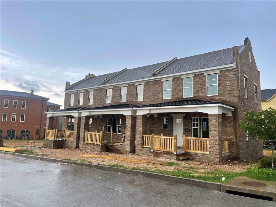 Beautiful three unit townhomes with easy access to I-49.  2 bed 2.5 bath all brick, with front and back porches, walk-in closets, granite countertops, and stainless steel appliances. 12 ft privacy fence between each unit. .  Enjoys Northwest Arkansas's newest shopping and dining district.  Located next to bike trails, bypass, NWA Mall and so much more.