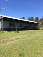 A must see mobile home that sits on 2.49 acres. Needs some repair, the floor supports are in excellent condition, has a roof built over the mobile home, carport and storage space available. Electric central heat & air with a propane wall unit! With a little work could be a great small home for a family or an excellent investment property. The site is laid-out nicely for potential additions.