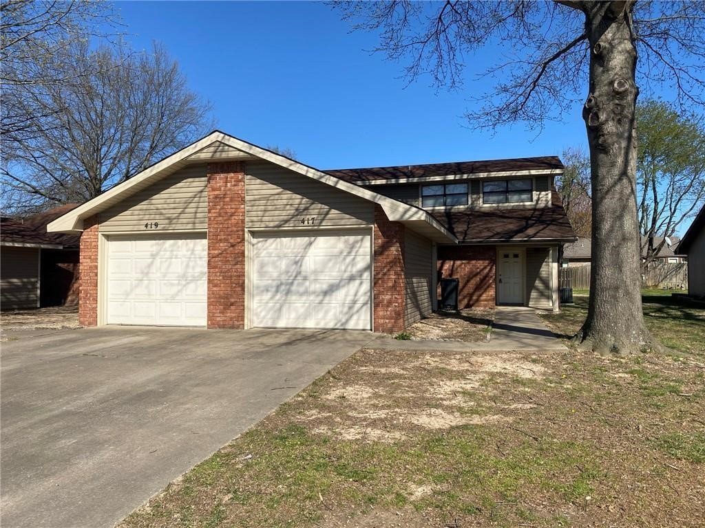2-story triplex in a great Rogers location! Close to I-49, shopping, schools, and restaurants. Main level features 1 bedroom, 1 bathroom, kitchen, and living room. Upstairs offers a loft-style bedroom and second bathroom. Wood-look tile in main areas and downstairs bedroom, with carpet upstairs. **Fireplace is not for use. No pets allowed.**