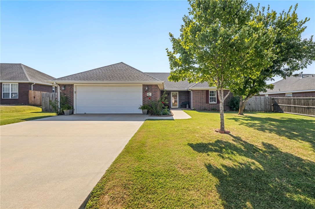 Immaculate one owner home ready for its new owner. The open concept living area is perfect for entertaining guests or keeping up with your favorite tv program. The living room is wired for sound and will include the freestanding gas fireplace. The kitchen has been upgraded with granite counters, has great storage and will include the refrigerator. The split floorplan offers generous sized bedrooms with large closets. There is a murphy bed in one of the rooms. This bed can stay or be removed. The laundry room is spacious and has extra lockable storage with a metal door. The back yard is private with a nice covered patio and natural gas hook up for your grill. Located a short distance from Hwy 49 or Hwy 71 on a quiet dead end street. Around a 10 min drive to the University of Arkansas. This home is great for all phases of life and will bring comfort and joy into yours.