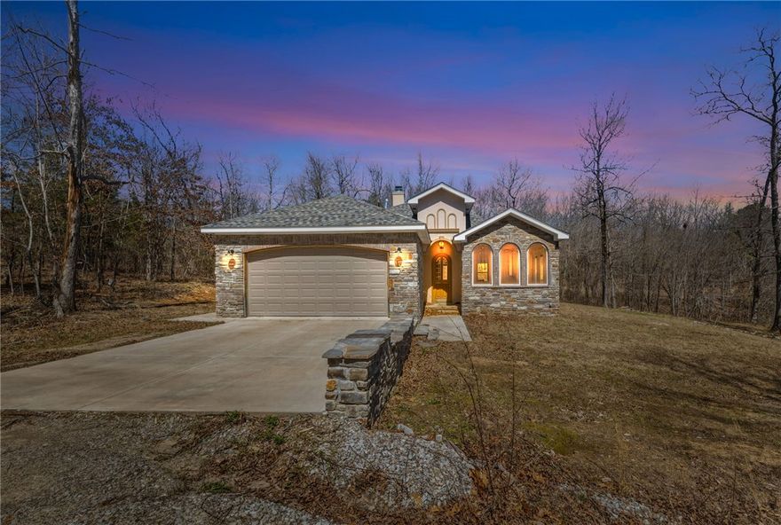 Welcome to your private retreat on 39 acres where comfort, versatility, and opportunity come together.  This brick and rock home offers 2 beds, 2 baths, a fireplace, quartz countertops, and a stunning stainless vent hood and appliances. Two dining areas provide flexibility for an office, sunroom, or additional living space. The primary suite features double walk-in closets, a soaking tub, and a shower ready for your finishing touch (tile on site). Enjoy peaceful pond views right from the home.

The 30x50 insulated shop includes plumbing, electric, mini splits, laundry hookups, and three overhead doors. Ideal for hobbies, business, or storage. Four cabins offer excellent income or guest potential: Cabin 1 (420 sq ft), Cabin 2 (672 sq ft), Cabin 3 (600 sq ft), Cabin 4 (692 sq ft). Property also includes RV hookups and two EV charging stations, adding even more flexibility. Whether you’re looking for a private homestead, income producing opportunity, or a place to spread out and enjoy the land, this one delivers!