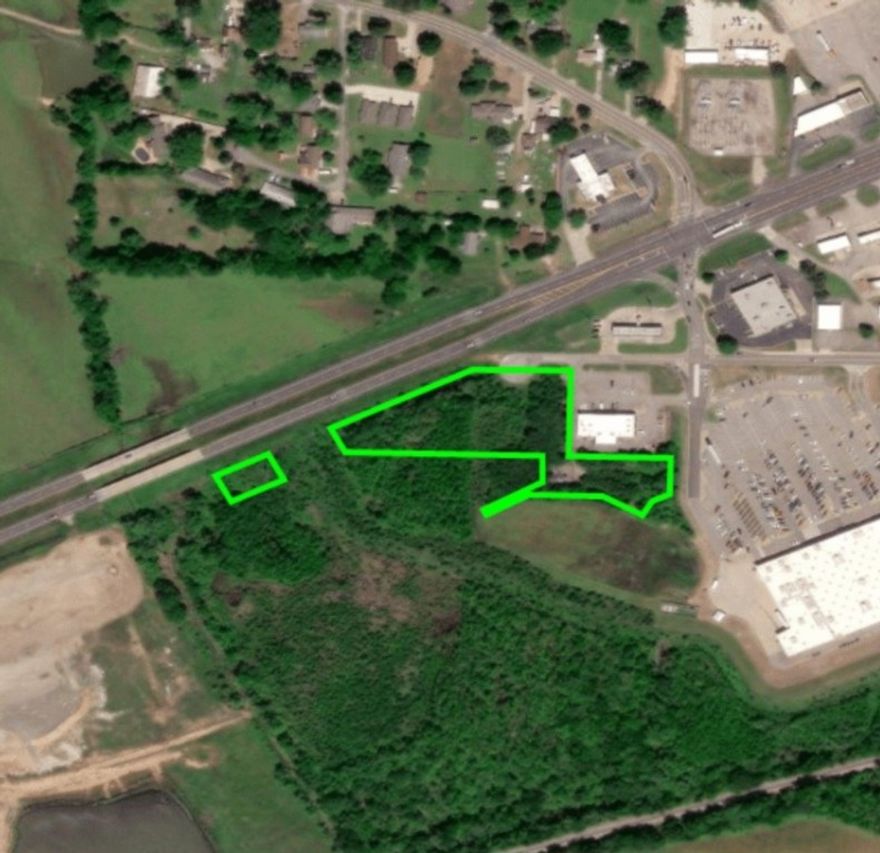 Discover 3.42 (+/-) acres of commercially zoned land that is right off Highway 64 (Alma Highway) with street frontage suitable for commercial building. Flat topography with abundant signage potential makes this site a standout. Ideal for large-scale users, retail anchors, or build-to-suit projects. There is currently no active carrier on the tower.