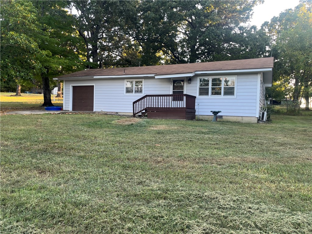 WHAT A STEAL! This home is sitting on a little over half an acre and minutes from shopping, medical, schools and employment! Also, minutes from Norfork Lake, North Fork River and White River Access. You will find an attached garage, recently updated bathroom, new flooring in the kitchen, new butcher block countertops, a new water heater, charming knotty pine walls, cedar lined closet, refinished hard wood floors in the living room and bedrooms. Two brand new mini splits to keep you cool on a hot day and cozy and warm on a cool winter night! Exterior has been freshly painted! You're going to love all the counter space in the kitchen, its long enough to create your own buffet at home! Outside you will find mature trees and a really cool outdoor area that looks to be perfect for an outdoor patio!