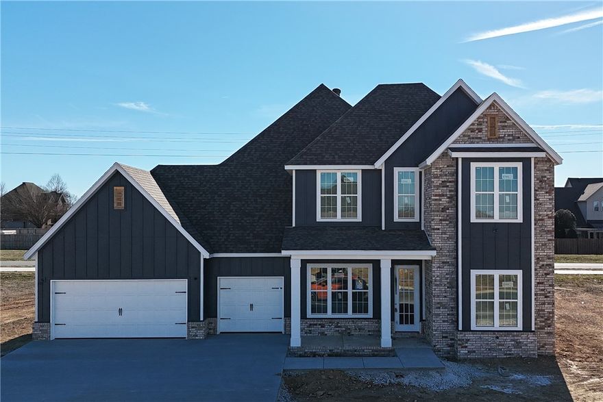 Welcome to County Line Square, a new community in Springdale next to Shaw Family Park that offers a pool and pavilion for residents. This home begins with 2 bedrooms and a full bathroom off the entry, giving you flexible space for guests or work. The hallway leads into the living room, where a gas fireplace creates a warm focal point, and engineered wood floors extend throughout the first floor. The kitchen and dining area flow from the living space and feature a large island, cabinets to the ceiling, GE Profile stainless steel appliances, and a pantry. The primary suite sits on its own side of the home and includes a vaulted bedroom, a double vanity with a centered makeup vanity, a walk-in shower, and a walk-in closet. The laundry room includes built-in cubbies and connects to the 3-car garage for a convenient drop zone. Upstairs offers 2 bedrooms and a full bathroom. A fence, gutters, and blinds are included. Builder’s preferred lender is offering $3500 toward closing costs or a rate buydown. *Agent Owned*