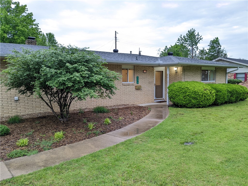 As you drive up to this beautiful home with new roof in 2022, you will immediately note that it conveniently sits on a corner lot with a circle drive. As you enter you will see that it has been lovingly cared for from the beautifully updated kitchen to the new LVP flooring throughout. This ranch-style home has a large open living room, with brick fire place, surrounded by built-in shelving, and new recessed lighting. From the living room, you go through glass sliding doors to the bonus room that would make a great in-law suite, media room, or 4th bedroom with a kitchenette area and full bathroom attached. From there you head outside to the fully fenced yard with inground storm shelter & storage shed. On the other side of the house you will find two bedrooms, a full bathroom, and the master bedroom with backyard access and it's own full bathroom. New water heaters in 2022 and 2023. This house is ready to have a new family love it! 5 minute walk to local elementary school and only minutes from I49. Come see it today!