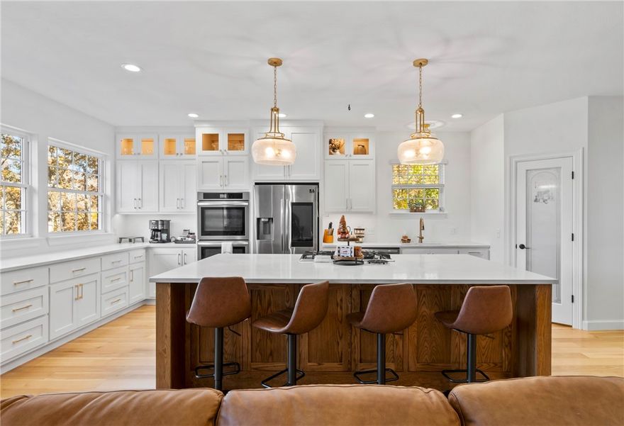 Beautiful country living in this renovated 3,500-square-foot estate, set on 3.5 acres with a short drive to Siloam Springs. Blending modern amenities with rural charm, this property offers spaciousness, privacy, and everyday convenience. Step inside to discover an open-concept living spaces, tall ceilings, and natural lighting. The updated kitchen is a chef’s dream, showcasing custom cabinetry, solid-surface countertops, top-tier stainless steel appliances, and a generous island perfect for hosting family and friends. Step into the primary suite with access to large back deck, complete with a spa-inspired bathroom featuring dual vanities, a walk-in shower, and 2 oversized closets. With five bedrooms, four and a half bathrooms, and a finished basement equipped with its own kitchenette, this home offers exceptional flexibility for guests, multi-generational living, or entertaining guest. Outside the 3.5-acre lot invites gardening, recreation, or anything you can imagine.