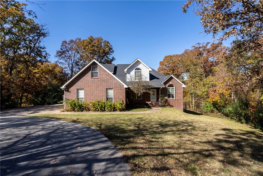 Beautiful country living in this renovated 3,500-square-foot estate, set on 3.5 acres with a short drive to Siloam Springs. Blending modern amenities with rural charm, this property offers spaciousness, privacy, and everyday convenience. Step inside to discover an open-concept living spaces, tall ceilings, and natural lighting. The updated kitchen is a chef’s dream, showcasing custom cabinetry, solid-surface countertops, top-tier stainless steel appliances, and a generous island perfect for hosting family and friends. Step into the primary suite with access to large back deck, complete with a spa-inspired bathroom featuring dual vanities, a walk-in shower, and 2 oversized closets. With five bedrooms, four and a half bathrooms, and a finished basement equipped with its own kitchenette, this home offers exceptional flexibility for guests, multi-generational living, or entertaining guest. Outside the 3.5-acre lot invites gardening, recreation, or anything you can imagine.