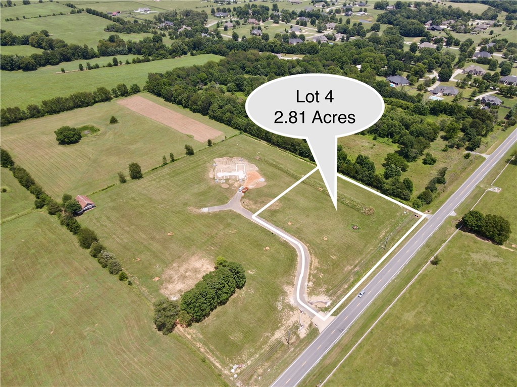 An exceptional opportunity to own 2.81 acres in one of east Fayettevilleās most desirable settings, within Goshen city limits. This premier estate lot is nestled in an exclusive 4-lot subdivision with a private entrance in the works that is designed to reflect the quality and elegance of the homes within. Build your luxury retreat using our curated design/build team or bring your own. All essential utilities are in placeāelectric, gas, fiber internetāwith a public water tap to be installed and included. Enjoy unmatched privacy and natural beauty just 7 minutes from Mission & Crossover and only 2 minutes from Beaver Lake access via the White River. A rare blend of refined living, convenience, and timeless Arkansas scenery.