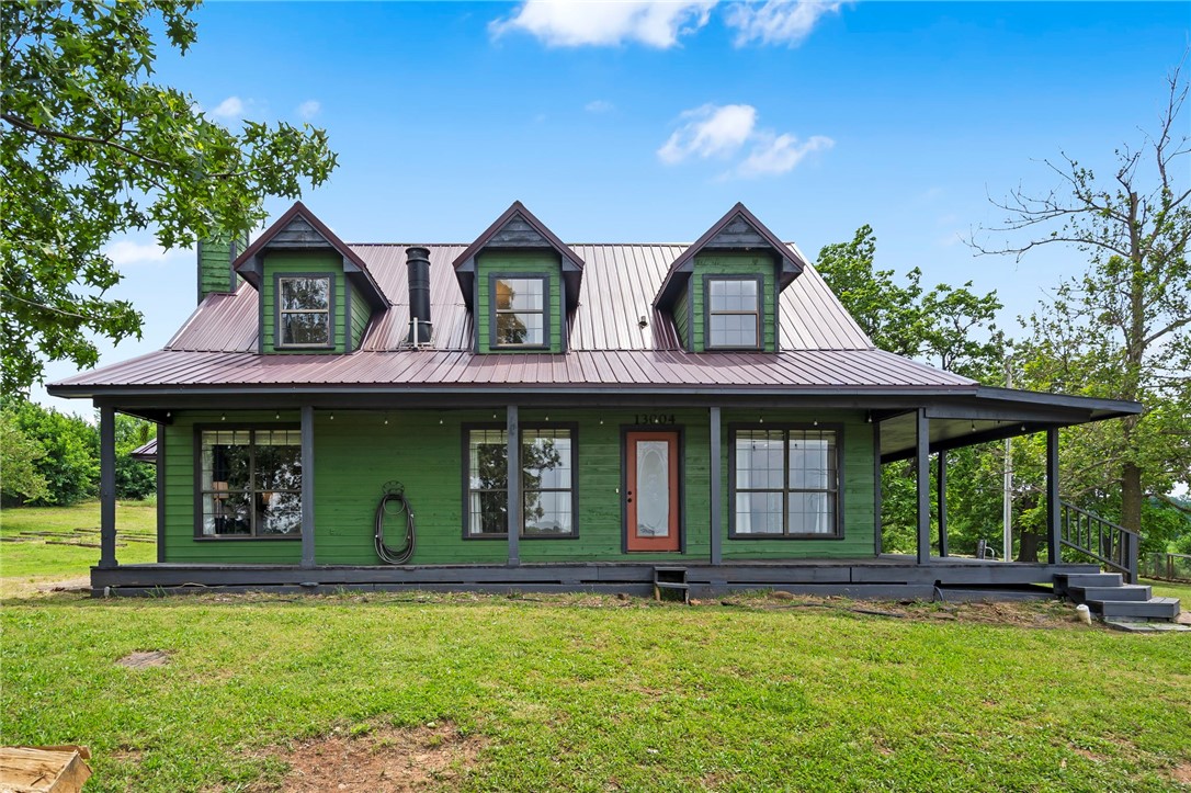 Full of charm and ready for your touch, this inviting home offers simple DIY projects to add value and make it your own. Enjoy the best of both worlds with this unique 3-story craftsman-style home on 2.11 acresāpeaceful and private, yet just minutes from town. Wake up to stunning sunrises and sip your morning coffee while taking in the rolling mountain views from the semi wraparound covered porch. The exterior features freshly painted cedar siding, a newer metal roof, and metal fencing. Inside, you'll find cathedral ceilings, tall windows for natural light, and a double-sided wood-burning fireplace connecting the living room and ownerās suite. The eat-in kitchen includes a pantry and electric appliances. The main-level primary suite boasts a soaking tub, walk-in shower, and dual marble vanity. Upstairs offers two bedrooms with new carpet and a full bath. The finished walk-out basement features a bonus room with new carpet, full bath with Razorback sink, laundry with utility sink, and an extended garage.