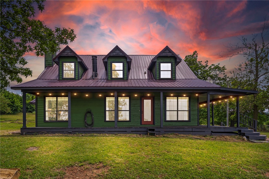 Endless Potential | Peaceful Setting | $5,000 Lender Credit!
Tucked on 2.11 private acres with mature trees and scenic mountain views, this 3-story craftsman offers peaceful seclusion just minutes from downtown Lincoln. Enjoy stunning sunrises from the semi-wraparound porch. The home already boasts key exterior upgradesālike cedar siding, a newer metal roof, and metal fencingāwhile still offering exciting opportunities for interior updates and personal touches. Inside, fresh paint, cathedral ceilings, and tall windows bring in natural light. A double-sided fireplace connects the living room and main-level suite with soaking tub, walk-in shower, and dual marble vanity. The eat-in kitchen includes a pantry and room to customize. Upstairs: 2 beds + full bath. Walkout basement includes bonus room, Razorback-themed half bath, laundry area, storm shelter, and oversized garage. Outside: hobby farm potential with chicken coop and egg-laying hens that convey. $5,000 preferred lender credit included!
