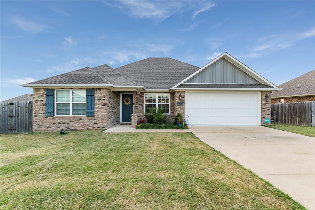 With 4 bedrooms, 2 baths, solar panels, and backyard extras, this home combines everyday function with lasting VALUE. It has been well cared for and offers a comfortable split floor plan with an open living and kitchen design. Solar panels stay at no additional cost, providing long term efficiency and savings! The backyard features thoughtful touches with an 8x12 greenhouse with electricity, a 6x6 storage shed, and a 9x9 concrete slab ideal for seating or grilling. Both side yards are gated and separately fenced for added versatility, AND the back fence opens to stairs that lead down to additional grassy space. Just minutes from local dining hot spots such as The Wooden Spoon and Honeywheat Bakery, with shopping and essentials nearby. Hwy 12 and Hwy 59 make commuting easy, with Bentonville only 20 minutes away and XNA 25 minutes from your door. This home qualifies for an RD loan, meaning zero down payment. You need to see this one to truly appreciate it!