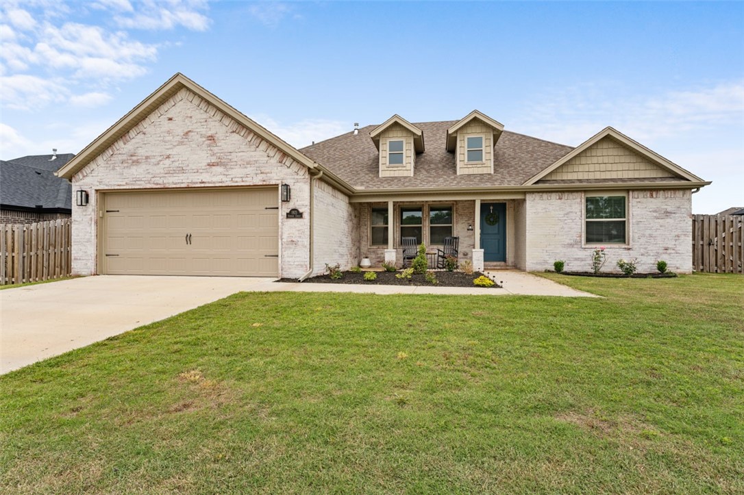 This adorable 3 bedroom 2 bath home is loaded with charm. Enjoy the covered front porch with nice surrounding landscaping. The spacious has a double sided gas fireplace that leads to the kitchen and dining area. Beautiful beams add lots of style and character. Split floorplan and large laundry room. This home is ready for it's next family to enjoy! Great opportunity to get into this subdivision at this price point! Walkable to nearby schools, baseball parks, etc. Act fast on this beauty!