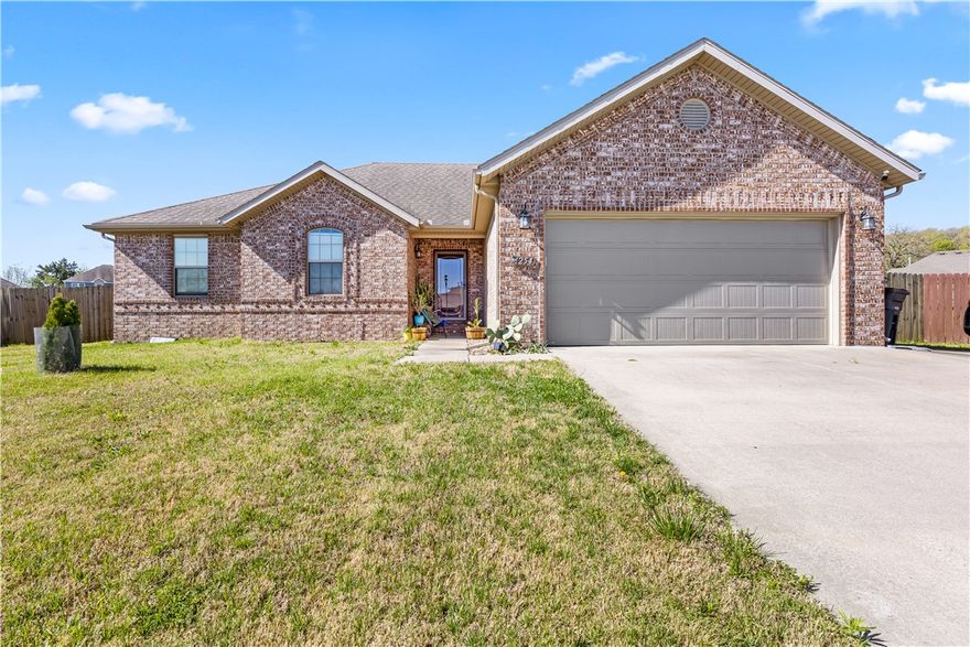 Beautiful 4BR/2BA all-brick home on a .41-acre lot with a desirable split floor plan. Spacious living room features wood flooring, a corner fireplace, and beam accents. The eat-in kitchen offers granite countertops, stainless steel appliances, white cabinetry, and indirect lighting.
The primary suite includes a tray ceiling, dual vanities, a walk-in shower, a whirlpool tub, and a large walk-in closet with built-ins. Enjoy the covered back patio overlooking a private, tree-lined backyard with full privacy fencing, perfect for relaxing or entertaining. Additional features include an attached 2-car garage.. Move-in ready and full of charm!