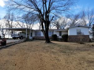Nice farm on pavement only 20 minutes out; outstanding view; good mixture of woods and pasture; two ponds home is on a well but can be hooked up to Bergman rural water; there are 3 BD / 1 BA with central H/A, barn, and several outbuildings