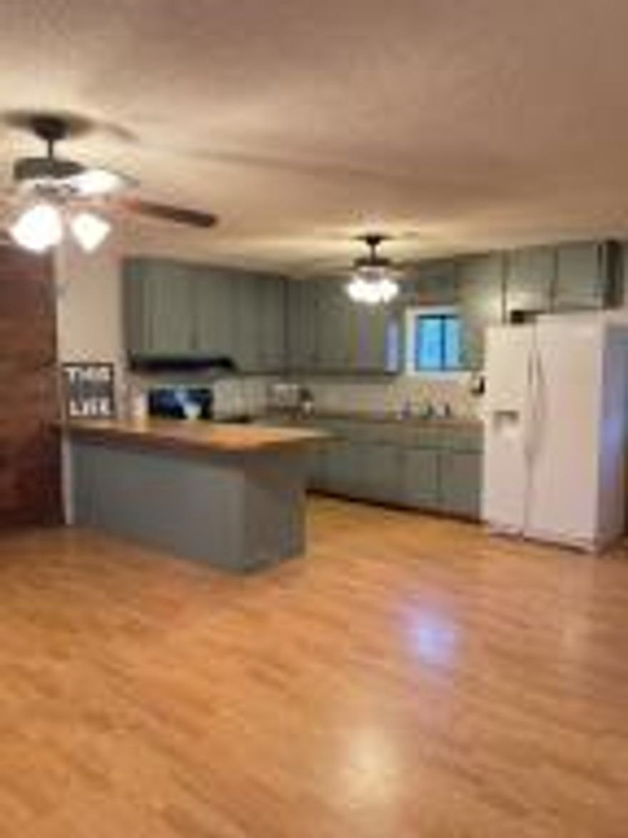 This country home is ready for you to make it your own.  This home offers three bedrooms, one bathroom. Relax on the large covered front porch and take in the beautiful mountain views. Enjoy backyard BBQ's as well as a large garage/workshop with electricity.  Set up your showing ASAP as this one will not last long and has been priced to sell.