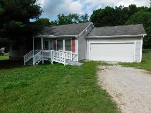 Small Town Living - 3 bedroom, 2 bath, double garage only $74,900!! Only a few blocks to grocery store, cafe, post office and full service bank, Plus short distance to Bull Shoals Lake for fishing and water sports. Includes nice kitchen-dine combo with new laminate flooring, pantry, living room, master bedroom with private bath, pantry, rear deck, chain link fenced back yard, ramp to front porch, double garage with opener - only $74,900 - come see right away! Age, sq ftg, lot size, acreage, utilities, etc, are from public records, Buyer should verify.