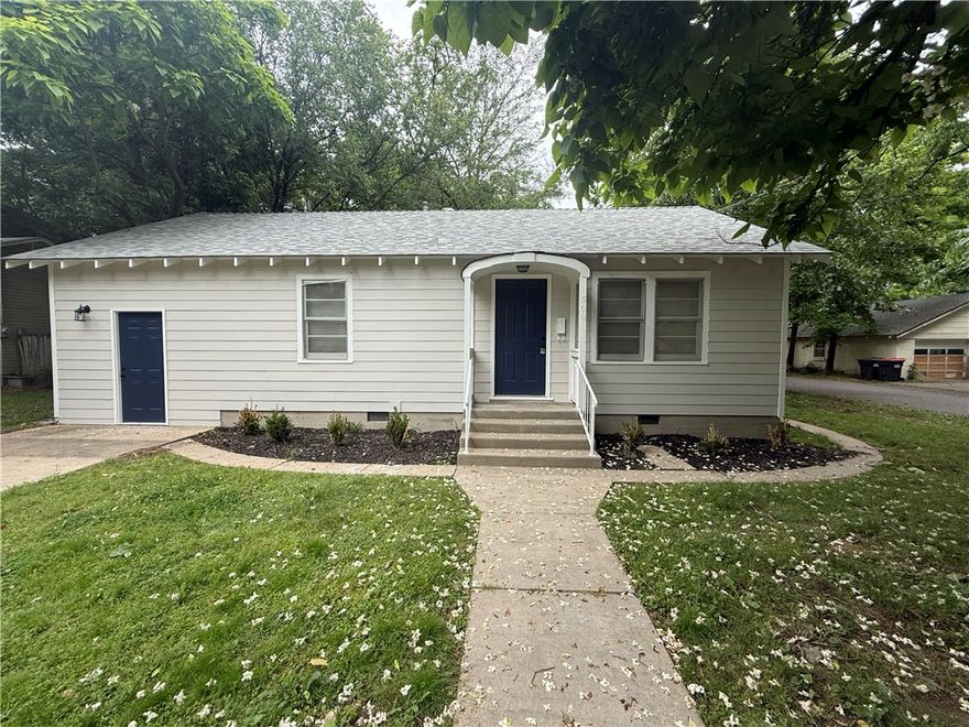 Charming 2 bed, 1 bath corner lot home offering 1,092 sq ft plus a versatile flex/living space from the converted garage. Features include new exterior siding, fresh interior paint, and updated flooring throughout. Located in an incredible spot just minutes from and walkable to downtown Springdale dining, shopping, and entertainment.