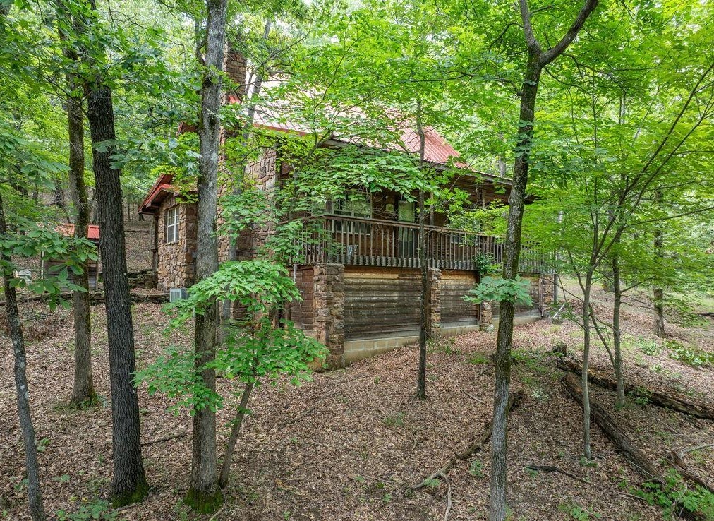 Very cozy, modern 1.5 loft home (looks new), never lived in except for a weekend or vacation week. Metal roof, native stone construction, rock flower beds & covered front porch. Wood-burning fireplace. Storage under front porch, well house, good well. Rural water on its way!