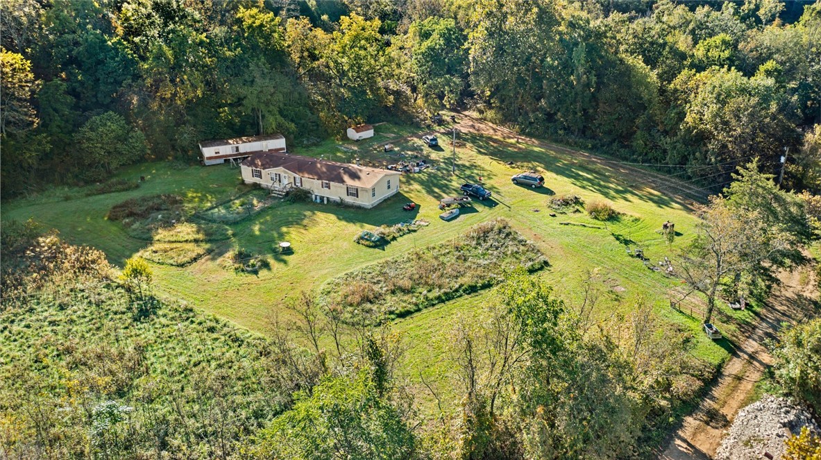 Discover the best of Northwest Arkansas country life on this stunning 10-acre property nestled along Parker Branch Road. Tucked away in the mountains, this serene retreat offers the perfect blend of natural beauty, privacy, and freedom. The land features a mix of mature woods and a spacious flat area at the bottom where the home restsāideal for enjoying quiet mornings surrounded by nature.
Wake up to breathtaking mountain views and endless opportunities to explore your own unrestricted land. Whether you dream of building, homesteading, or simply living off the beaten path, this property offers incredible versatility. Just a short distance from the White River, outdoor adventures like fishing, floating, and hiking are right at your doorstep.
With its remote setting and easy access to some of the most scenic areas in Northwest Arkansas, this property is a rare find for those seeking true mountain living and connection to the outdoors.
Smaller mobile home will be removed before closing.