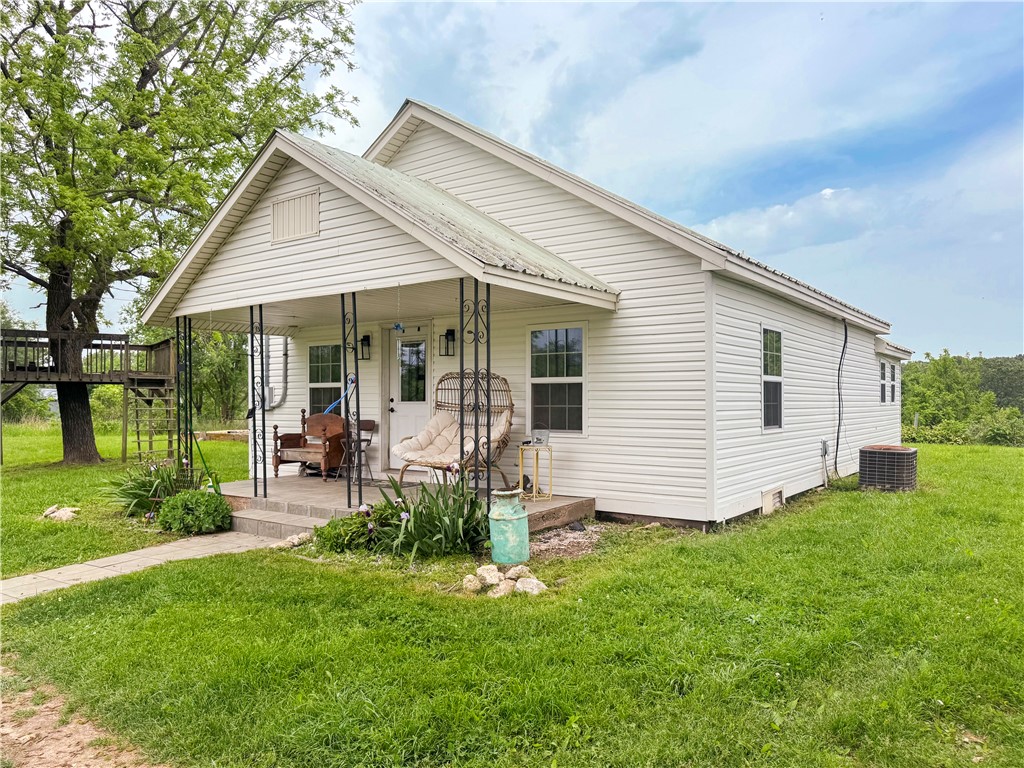 Charming updated farmhouse on 1 acre just south of Burlington—less than a mile off Hwy 65, offering the perfect mix of quiet country living and convenient access to town. Recent updates include a refreshed kitchen, new windows, and a durable metal roof. The covered front porch is ideal for relaxing, and the large yard features mature shade trees, space to garden or play, and even a treehouse for the kids. Whether you're a first-time buyer or looking to downsize, this move-in ready home is a must-see!