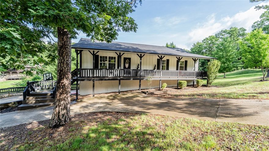 Just minutes from the Highway 12 boat launch and all the attractions of Northwest Arkansas, this beautifully remodeled property is set up as a turn-key short term rental. Keep it as such or convert it into a vacation home for big family getaways. 

Its eye-catching white exterior, stylish siding, crisp rooflines, and tasteful finishes create instant curb appeal that attracts both guests and buyers alike. Energy-efficient windows and clean architectural lines add to the home’s polished, low-maintenance charm—key qualities for any income-generating property.

Step inside to find durable 3/4” oak hardwood floors, rustic pine log accent walls, and an updated game room—all designed for comfort, style, and functionality. The backyard contains a pergola, in-ground plunge pool, and two spacious decks—ideal for hosting gatherings or maximizing nightly rates.

Act fast to start collecting income or enjoying your summer by the lake. SELLER IS OFFERING $10,000 IN CONCESSIONS able to be used towards anything.