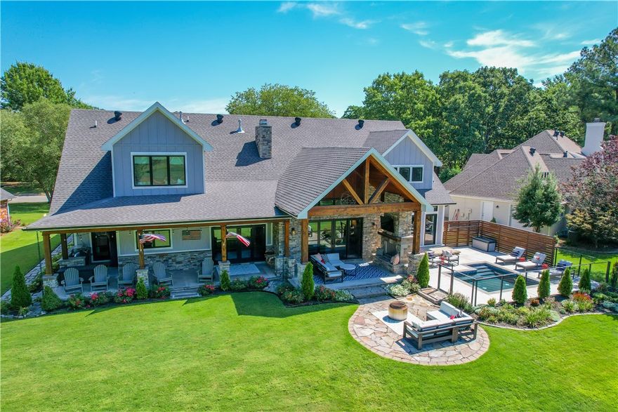 Beautiful views of #7 hole on SCC and that’s not even the best part. Complete attention to all details in this perfectly crafted custom home. Gourmet kitchen includes 48’ gas stove, 2 dishwashers, sizable marble island and 3 sinks. Kitchen flows so thoughtfully into coffee bar, wet bar and pantry with outdoor access to grilling area. Huge utility/hobby room leads to even more entertaining space and is located next to dedicated workout room. Kitchen and living area featuring an overlooking loft with barn wood ceiling is divided by a double-sided rock fireplace. First floor master boasts 2 story vaulted ceilings and opens out to serene in ground hot tub/plunge pool. Resort style master bath includes his and her closets and toilet rooms. Modern staircase with cable railing leads to the second level. 3 additional bedrooms with dedicated bathrooms. There is also an unbelievable game room with a built-in wet bar.