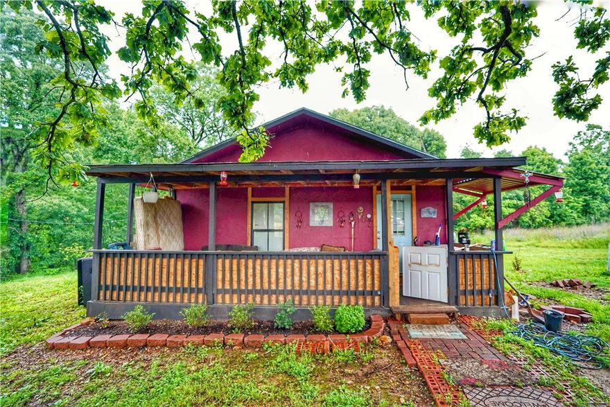 Small home with 5 acres of unrestricted land in Rogers! Escape the everyday on this peaceful 5-acre property. Featuring a simple, small home, this is your opportunity to embrace country living with the convenience of being a few minutes away from Downtown Rogers. Imagine the possibilities for gardening, recreation, or simply enjoying the space and privacy, all within reach of city amenities.