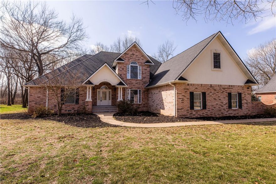 Located on a quiet, established street in Siloam Springs, this spacious home offers flexible living space on a 0.93-acre lot. With 4 bedrooms and 2.5 baths, plus a bonus room, craft room and additional sitting room, there’s space for everyone to spread out and make it their own. Inside, you’ll find a stunning living room with vaulted ceilings and built-in features that add character and functionality. An eat-in kitchen, and a dedicated formal dining space are perfect for gatherings. A private office provides work-from-home convenience. The primary suite has two walk-in closets. A storm shelter/safe room is located in the primary bath walk-in closet. The home also includes a brand new roof. The nearly one-acre yard offers mature trees and space to enjoy outdoor living, within walking distance of John Brown University. Homes on Avery Place are rarely available. This is a unique opportunity to own a substantial property in a prestigious location with the chance to update and personalize to your own taste.
