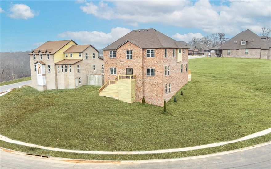 Must-see new construction home in an amazing location! This immaculate 5 bedroom, 4.5 bath Gramercy Park build boasts an open concept floor plan filled with modern touches, two story ceilings with an abundance of natural light streaming in, and upgrades throughout. The eat-in kitchen is a chef's dream with its oversized island, quartz countertops, walk-in pantry, gas range, and beautiful backsplash. Additional amenities include a home office, formal dining room, large laundry room, and home gym. Unwind in the master suite complete with tray ceilings and a spa-like ensuite bathroom with stand alone soaking tub, tiled walk-in shower, his and hers vanity, and oversized walk-in closet with built-in shelving. Neighborhood amenities include a community pool and clubhouse. Located in a quiet neighborhood just moments from local schools, parks, Downtown Bentonville, and endless miles of biking trails, this home could not be in a better location.
