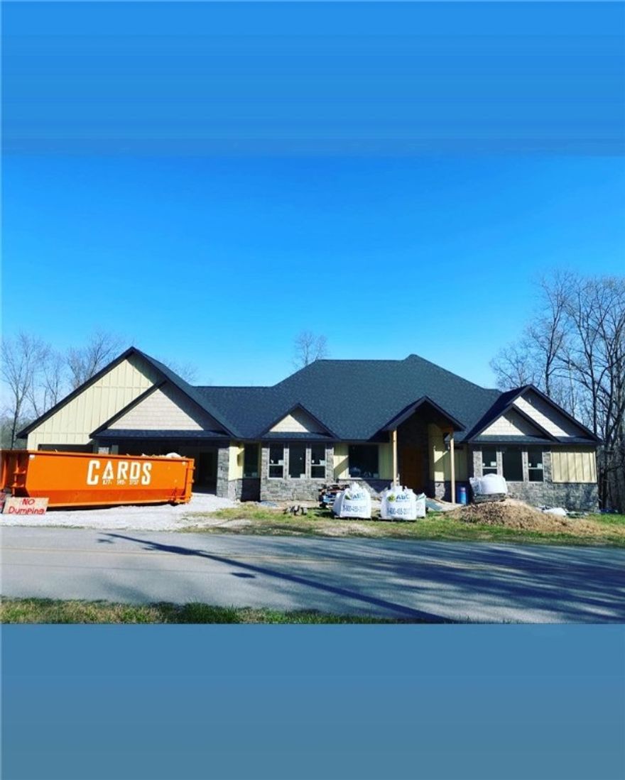 New Construction! Beautiful home with 4 bedrooms and 4.5 baths. Enjoy a huge back deck, 2.5 acre lot on a quiet road with a cul-de-sac and peaceful living that feels "out" but, is only 5 miles from downtown Bentonville. This amazing new home offers tons of detail including soaring 10' ceilings with trays, a vaulted living room with cedar beams, custom cabinetry, built-ins and high quality interior trim. All bedrooms have full bathrooms. Additional features include an office, oversized stone fireplace and a huge pantry/mudroom. Supplied with well water. Plenty of room to add a shop building, terrace pool etc.