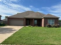 Welcome to your next home! This 4 Bedroom 2 Bath home has desirable features include designer kitchen, custom cabinets, gas range, granite, tile shower, wood tile floors, carpet in bedroom 2" faux wood blinds, fireplace, and covered patio. Background and Credit Check required. Home is being updated with new paint and other items. Will be ready to move in close. to October 15.