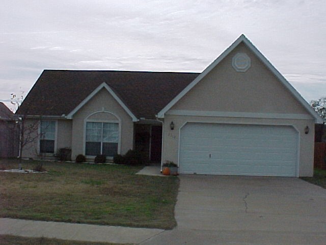 3 bedroom 2 full bath with open floor plan - Gas fireplace in living room and laminate wood flooring in main living area. Privacy fenced yard and covered deck.