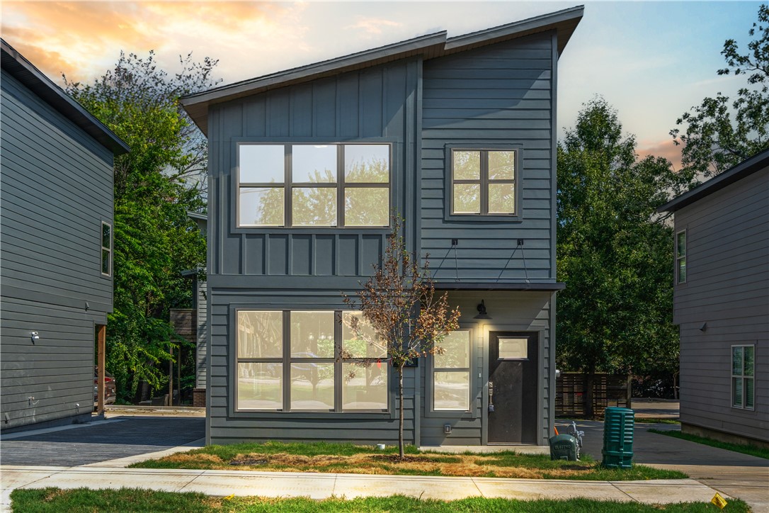 Discover turnkey luxury in this newly built Fayetteville home, perfectly positioned for the ultimate walkable/bikeable lifestyle. Just moments from the U of A campus, the Razorback Greenway trail, dining, and shopping. This sophisticated 3-bed, 2.5-bath residence features premium upgrades including extra-thick granite counters, a full suite of Frigidaire Gallery appliances with a gas range with a convection/air fry oven, and a central tech hub with high-speed ethernet. Enjoy a private, low-maintenance yard and coveted off-street parking for 3 cars. With I-49 less than 5 minutes away, all of Northwest Arkansas is at your doorstep. This is effortless, elevated living.