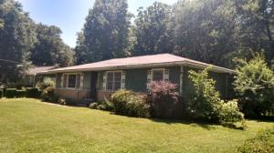 Lots of potential on this solid 3 bedroom, 1.5 bath home setting on a level corner lot just outside the city limits. This one features beautiful original hardwood floors, clean sheet rock walls and ceilings, and brand new gas central heating. Needs a little TLC on the outside. This home has had only two owners and has never been rented.