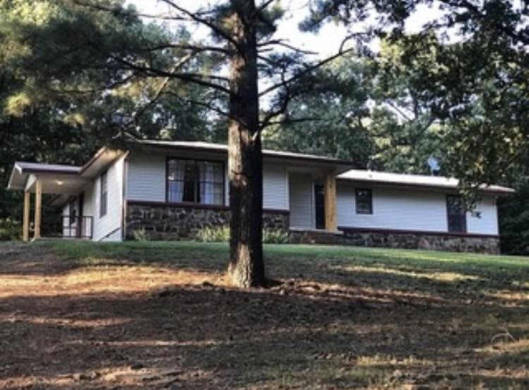Nice 4 bedroom 2 bath home on 1.33 mostly open acres in a country setting with great location. Low maintenance siding and native stone exterior. Newer appliances, new HVAC last year, newer septic, Newer vinyl siding. Less than 1/2 mile of gravel road. Within 30 minutes of Fayetteville. Rural water, well, Ozarks-Go on the way. Great value at this price. Don't wait to schedule a showing.