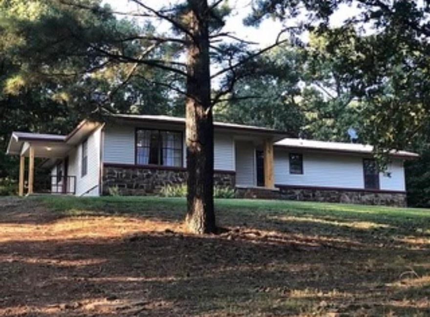 Nice 4 bedroom 2 bath home on 1.33 mostly open acres in a country setting with great location. Low maintenance siding and native stone exterior. Newer appliances, new HVAC last year, newer septic, Newer vinyl siding. Less than 1/2 mile of gravel road. Within 30 minutes of Fayetteville. Rural water, well, Ozarks-Go on the way. Great value at this price. Don't wait to schedule a showing.