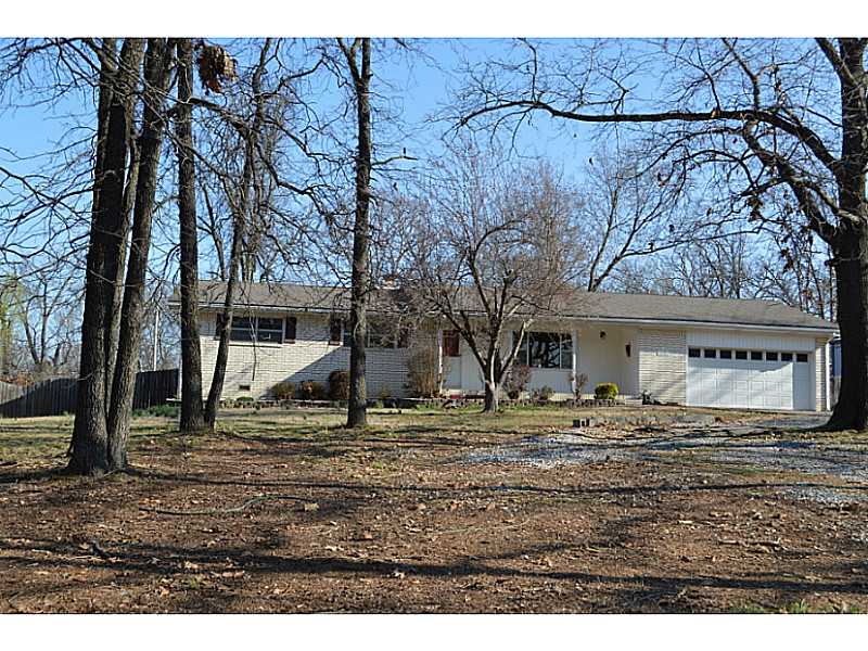The Edge of Town! Large lot on paved road just outside of city limits. All brick with 2 living areas, wood burning fireplace, tile in wet areas, some updates.,Bank owned property. Being sold AS IS, owner makes no warranties or representations about the property. Cash or conventional loan only. Will not qualify for RD loan or FHA