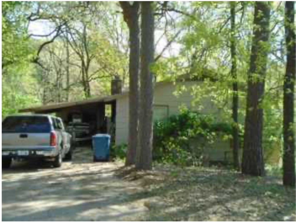 Nice popular floor plan with 2 bedrooms, 1.5 baths, oversized carport. Storage area off of carport. Nice sized lot .38 acre plus common property adjoining. Fixer Upper, Sold As Is... No repairs will be done. Check with your agent for suggestions on viewing the property.