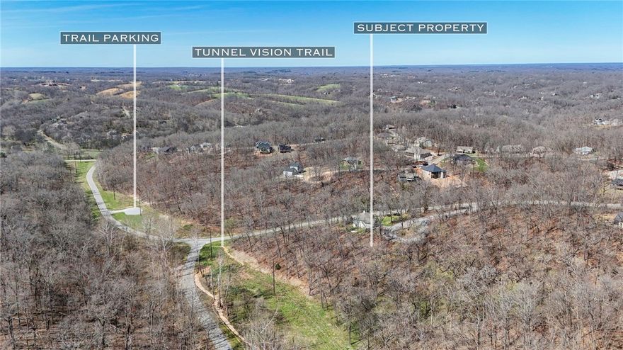 Large lot with Tunnel Vision Trail right behind it.  Lots of room to build your house on a lot great for a walkout basement.  Minutes from downtown Bentonville and the new Bike Lift.  Get it before it's gone!