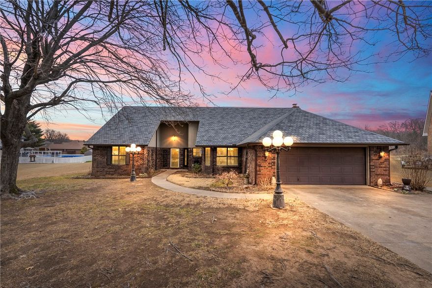 2 Bed 2 Bath home outside city limits on almost half an acre.Step inside to soaring cathedral ceilings & abundant natural light throughout.The spacious layout features both a formal dining area & eat-in kitchen, complete with granite countertops,freshly painted cabinets,windows at kitchen sink,pantry, blinds & new dishwasher & electric double-oven range (2025)—plus one oven with air-fryer functionality.A cozy gas-assist wood-burning fireplace anchors the living room, where a hidden wet bar behind a sliding barn door adds a unique entertaining touch.Recent 2026 upgrades include new gutters with 10 year warranty,gas water heater,septic system cleaned,light fixtures,freshly painted trim & doors. Stunning bathroom renovations featuring butcher-block vanities with soft-close cabinetry, new sinks & hardware, custom tile shower & new plumbing in primary bath. Has generous storage & an oversized garage with built-in cabinets, shelving, & its own window unit. Enjoy a huge covered patio with a natural gas plumbed BBQ Grill.