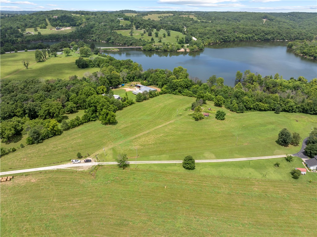 A rare find on Table Rock Lake!
This beautiful property includes two level, clean and peaceful lots totaling 6 acres. The perfect canvas for your dream home, lake retreat or weekend escape. Conveniently located near Enon Bridge, where Long Creek and Yocum Creek meet the main channel of Table Rock Lake, this property provides natural beauty with practical amenities already in place. Improvements include: Two septic systems, buried propane tank, electric, rural water & a private well, RV hook-up, existing storm shelter and storage building. Opportunities like this don't wait - bring your plans, your vision and make this rare Table Rock Lake property your own.
Combined tax for both lots $437.00.